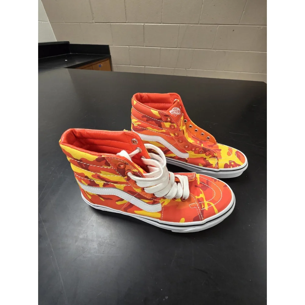 Vans Sk8-Hi high-top sneakers in an orange and yellow camouflage